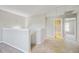 Upstairs hallway has neutral carpeting and two doorways at 330 Albrighton Way, Moncks Corner, SC 29461