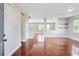 Inviting open-concept living space with hardwood floors and a glimpse of the staircase and entryway at 330 Albrighton Way, Moncks Corner, SC 29461