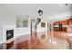 Bright, open-concept living area features a fireplace, hardwood floors and a seamless flow into the kitchen at 330 Albrighton Way, Moncks Corner, SC 29461