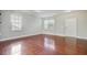 Bright and airy living room showcasing gleaming hardwood floors and natural light at 330 Albrighton Way, Moncks Corner, SC 29461
