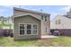 Spacious backyard featuring a patio area, mature trees, and privacy fence at 3844 Annapolis Way, Ladson, SC 29456