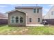 View of the backyard and patio with home's exterior at 3844 Annapolis Way, Ladson, SC 29456