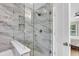 Water closet featuring marble look tile, a glass-enclosed shower, and a bench at 3844 Annapolis Way, Ladson, SC 29456