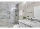 Bathroom featuring a glass-enclosed shower with marble-look tiles, and a vanity with a marble countertop at 3844 Annapolis Way, Ladson, SC 29456