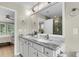 Bathroom featuring a double vanity with marble countertop, white cabinets, and a view into the water closet at 3844 Annapolis Way, Ladson, SC 29456