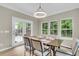 Dining area is filled with natural light from the windows and doors with backyard views at 3844 Annapolis Way, Ladson, SC 29456