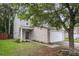 Two-story home features a two-car garage, well-manicured lawn, and classic siding, framed by mature trees at 3844 Annapolis Way, Ladson, SC 29456