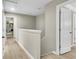 Bright hallway featuring a storage closet, wood floors, and neutral paint colors at 3844 Annapolis Way, Ladson, SC 29456