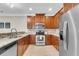 Kitchen with stainless steel appliances and wood cabinets at 3844 Annapolis Way, Ladson, SC 29456