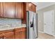 Gourmet kitchen featuring stainless steel refrigerator and marble countertops at 3844 Annapolis Way, Ladson, SC 29456
