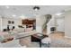 Inviting living room with a neutral color palette, modern furnishings and open layout to the kitchen and staircase at 3844 Annapolis Way, Ladson, SC 29456