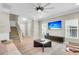 Cozy living room with a large TV, modern fan, and comfortable seating at 3844 Annapolis Way, Ladson, SC 29456