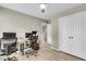 Home office featuring neutral walls, a ceiling fan, modern desks and chairs, and a storage closet at 3844 Annapolis Way, Ladson, SC 29456