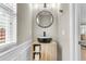 Stylish powder room features a unique vessel sink, wood cabinet and contemporary fixtures at 3844 Annapolis Way, Ladson, SC 29456