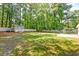 Large backyard offering ample space for outdoor activities, complete with storage shed and fire pit at 403 Forest Cir, Summerville, SC 29483