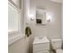 A clean, well-lit bathroom features a vanity, mirror, and toilet at 403 Forest Cir, Summerville, SC 29483