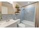 A clean bathroom features blue tile, a shower/tub, and a vanity with modern fixtures at 403 Forest Cir, Summerville, SC 29483