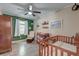 Cozy Bedroom with a crib, a glider, hardwood floors, and decor at 403 Forest Cir, Summerville, SC 29483