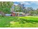 Charming brick home with green shutters and well-manicured lawn in a neighborhood setting at 403 Forest Cir, Summerville, SC 29483