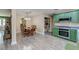 Open kitchen with dining area, walk-in pantry, stainless steel oven, and green cabinetry at 403 Forest Cir, Summerville, SC 29483