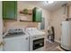 Convenient laundry room with modern washer, dryer, and ample storage space at 403 Forest Cir, Summerville, SC 29483