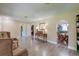 Open-concept living space showcasing an elegant console table and hardwood floors at 403 Forest Cir, Summerville, SC 29483