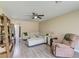 Inviting living room featuring a large sectional sofa, hardwood floors and natural light at 403 Forest Cir, Summerville, SC 29483