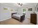 Cozy bedroom with a comfortable bed, soft carpet, and ample natural light at 418 Lakeview Dr, Summerville, SC 29485