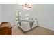 Bright bedroom featuring a comfortable bed, soft lighting, and serene outdoor view at 418 Lakeview Dr, Summerville, SC 29485