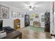 Bright bedroom with hardwood floors, natural light and decorative automotive themed wall art at 418 Lakeview Dr, Summerville, SC 29485