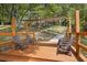 Inviting deck featuring comfortable seating and scenic views of lush greenery and the home exterior at 418 Lakeview Dr, Summerville, SC 29485