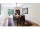 Cozy dining room with natural light, showcasing a wooden table set on a decorative rug, perfect for Gathering meals at 418 Lakeview Dr, Summerville, SC 29485