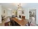 Dining room with a wooden table with six chairs, and a view into the foyer at 418 Lakeview Dr, Summerville, SC 29485