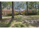 Beautiful brick home featuring a well-manicured lawn and symmetrical design, exuding curb appeal and classic charm at 418 Lakeview Dr, Summerville, SC 29485