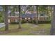 Charming brick home featuring a well-manicured lawn and symmetrical design, exuding curb appeal and classic charm at 418 Lakeview Dr, Summerville, SC 29485