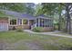Charming brick home with a screened-in porch, well-maintained lawn and mature landscaping at 418 Lakeview Dr, Summerville, SC 29485