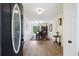 Inviting foyer with hardwood floors and a view into the dining room, showcasing the home's open layout at 418 Lakeview Dr, Summerville, SC 29485