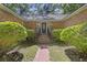 The brick stairs lead to the front door, framed by manicured bushes for a welcoming entry at 418 Lakeview Dr, Summerville, SC 29485