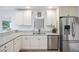 Bright kitchen with stainless steel appliances, granite countertops, and white cabinetry at 418 Lakeview Dr, Summerville, SC 29485