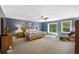 Spacious main bedroom featuring a ceiling fan, large window and natural light at 418 Lakeview Dr, Summerville, SC 29485