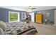 Inviting main bedroom featuring a large window and calming blue walls at 418 Lakeview Dr, Summerville, SC 29485