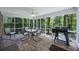 Inviting screened porch with brick flooring, comfortable seating, and outdoor grill at 418 Lakeview Dr, Summerville, SC 29485