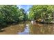 Scenic waterfront with a private dock, offering serene water views and boating access amid lush greenery at 418 Lakeview Dr, Summerville, SC 29485