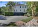 Large 2-story home features an attached 2-car garage and basketball court at 418 W Carolina Ave, Summerville, SC 29483