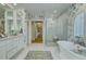 Bathroom with double vanity, stand alone tub and glass shower at 418 W Carolina Ave, Summerville, SC 29483