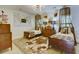 Unique bedroom with two twin beds, eclectic decor, and unique lighting fixtures at 418 W Carolina Ave, Summerville, SC 29483