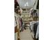 Walk-in closet with clothing racks and shelves for shoes and accessories at 418 W Carolina Ave, Summerville, SC 29483