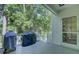 Outdoor deck features a grill and serene views of the surrounding trees at 418 W Carolina Ave, Summerville, SC 29483