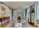 Formal dining room with a chandelier, long table, and blue wallpaper at 418 W Carolina Ave, Summerville, SC 29483