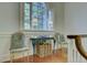 Bright foyer area with arched window, lamps, elegant table, and seating at 418 W Carolina Ave, Summerville, SC 29483